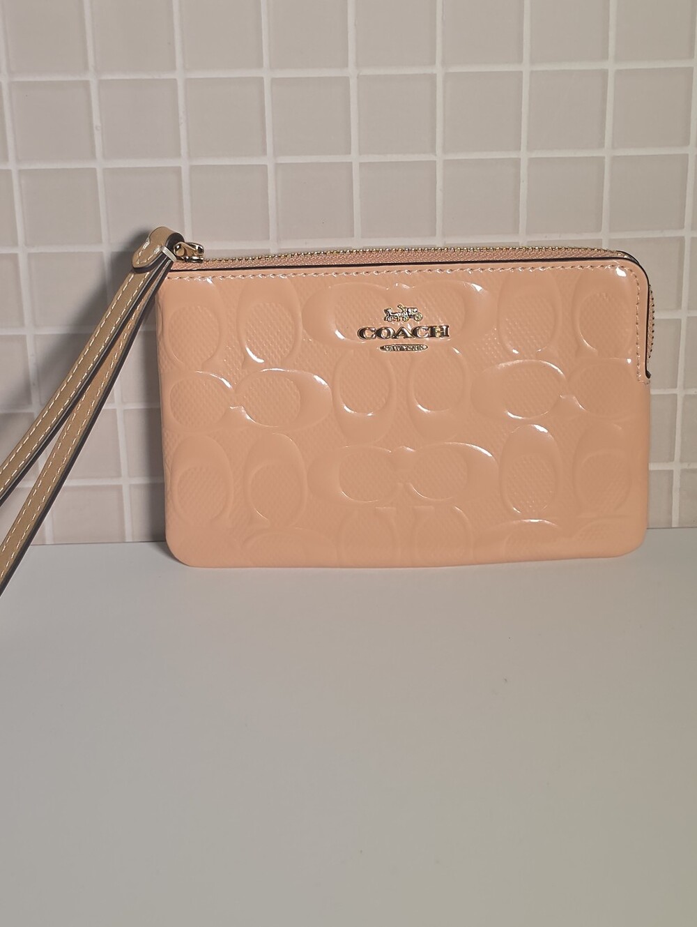 Coach Peach Patent Leather Wristlet with Signature Embossing
